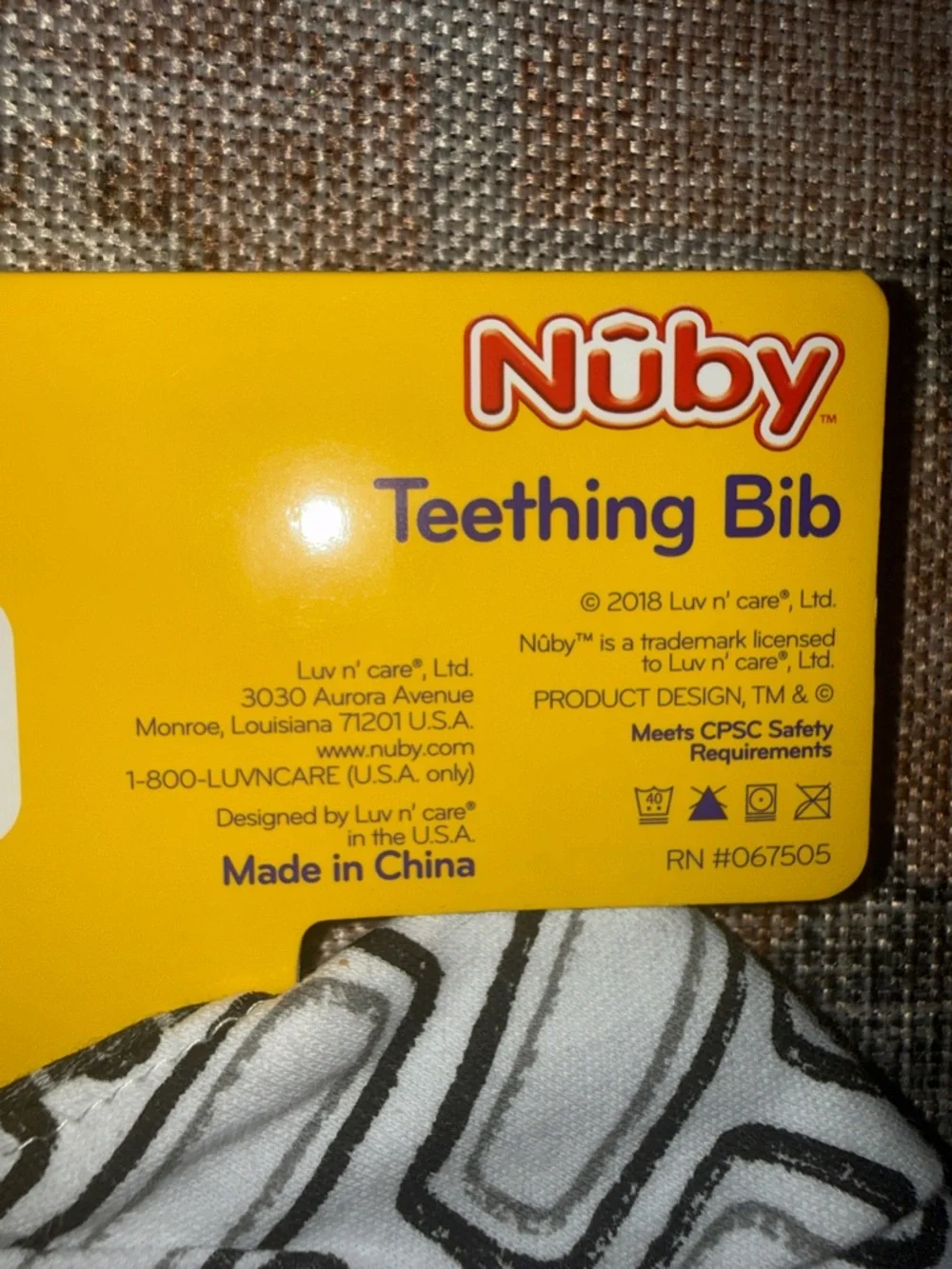 Brand new Nuby Teething Bib in Black & White with Teething Corner